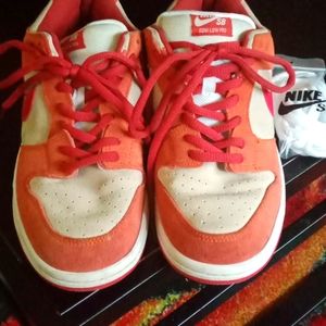 Red and white Nike SB dunks Lows